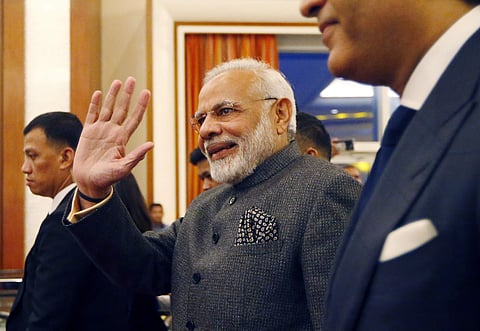 PM Modi waves to the crowd as he arrives to address businessmen in a parallel event of the 31st ASEAN Summit and Related Summits Monday, Nov. 13, 2017 in Manila, Philippines.(AP)