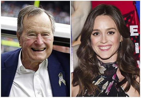 Lind accused former President George H.W. Bush of touching her from behind while she was posing for a photo alongside him and telling her a dirty joke at a Houston event in 2014.|AP