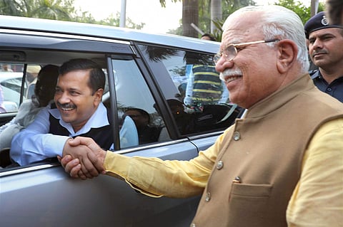 Haryana Chief Minister Manohar Lal shakes hands with Delhi Chief Minister Arvind Kejriwal after a meeting in Chandigarh on Wednesday. | PTI