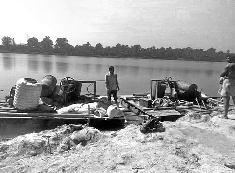 Workers instal equipment for soil testing at second Brahmani bridge site in Rourkela | Express