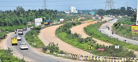 Motorists pass through narrow roads at Karanodai due to delay in widening of the Chennai-Tada NH. Sharp turns and potholes also contribute to motorists’ misery | P Jawahar