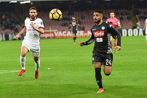 Napoli's Lorenzo Insigne, right, and Milan's Fabio Borini vie for the ball during the Italian Serie A soccer match. | AP