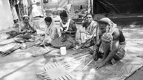 Group of women artisans crafting decorative items with bamboo at Purnachandrapur area in Baripada
