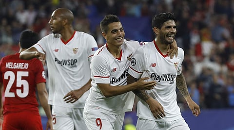 Sevilla's Ever Banega, right, celebrates with teammate Wissam Ben Yedder scoring his side's first goal during a Champions League group E soccer match between Sevilla and Spartak. | AP