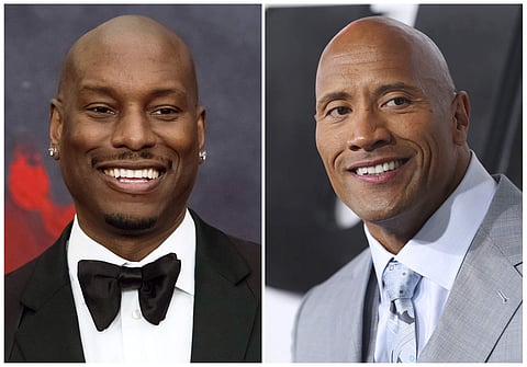 This combination photo shows Tyrese Gibson at the Black Girls Rock! Awards in Newark, N.J., left, and Dwayne 'The Rock' Johnson at the premiere of 'Furious 7' on April 1, 2015, in Los Angeles | AP
