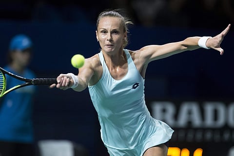 Slovakia's Magdalena Rybarikova plays a return during the first round match against Russia's Maria Sharapova at the Kremlin Cup tennis tournament in Moscow, Russia, Tuesday, Oct. 17, 2017. | AP