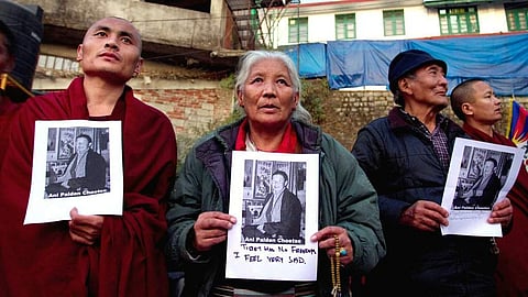 Exiled Tibetans in Dharamsala, India, on Thursday with pictures of a Buddhist nun who set herself on fire to protest Chinese rule. (Photo | Associated Press)