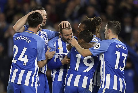Brighton & Hove Albion's Jose Izquierdo, no 19, celebrates scoring his side's second goal of the game with team-mates during their English Premier League soccer match at the AMEX Stadium. | AP