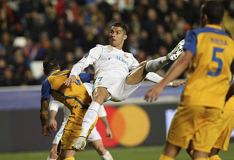 Cristiano Ronaldo scores the fifth goal of Real Madrid during the Champions League Group H soccer match against APOEL Nicosia. | AP