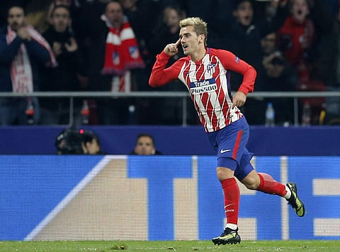 Atletico Madrid striker Antoine Griezmann celebrates his goal during a Champions League group C soccer match between against Roma. | AP