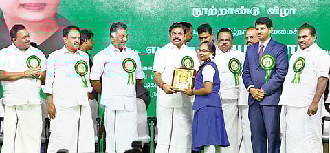 Chief Minister Edappadi K Palaniswami handing over welfare aid to a beneficiary during the MGR centenary celebration function in Thoothukudi on Wednesday | Express