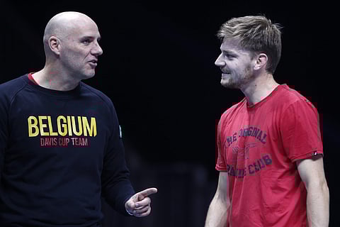 Captain Johan Van Herck of Belgium, left, speaks with David Goffin of Belgium during a training session at the Pierre Mauroy stadium in Lille. | AP