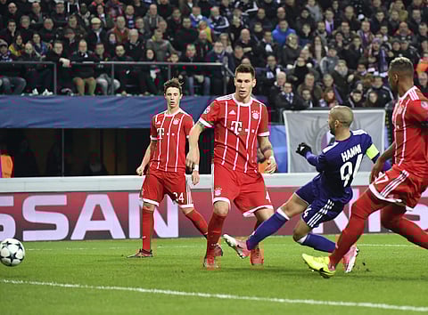 Anderlecht's Sofiane Hanni, second right, shoots the ball to score his sides first goal during a Champions League Group B soccer match between Anderlecht and Bayern Munich at the Constant Vanden Stock stadium in Brussels, Belgium, Wednesday, Nov. 22, 2017