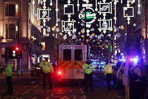 Police secure a cordon along Oxford street following an incident in central London on November 24, 2017. | AFP