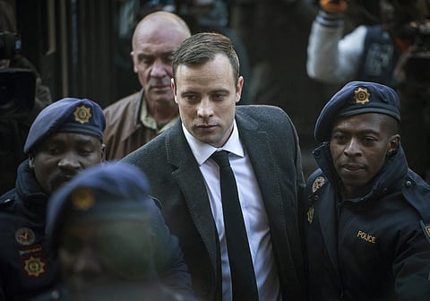 Oscar Pistorius (C) arrives at the High Court in Pretoria, South Africa (File | AP)