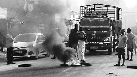 Protestors burn tyres during the bandh on Friday | Express