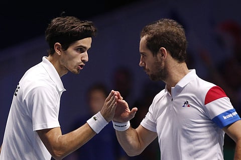 France's Richard Gasquet, right, and Pierre-Hugues Herbert celebrate after winning a point as they play Belgium's Ruben Bemelmans and Joris De Loore during their Davis Cup final double match. | AP