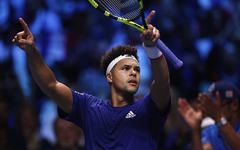 France's Jo-Wilfried Tsonga celebrates after defeating Belgium's Steve Darcis during their Davis Cup final single match at the Pierre Mauroy stadium in Lille, northern France, Friday, Nov. 24, 2017. | AP