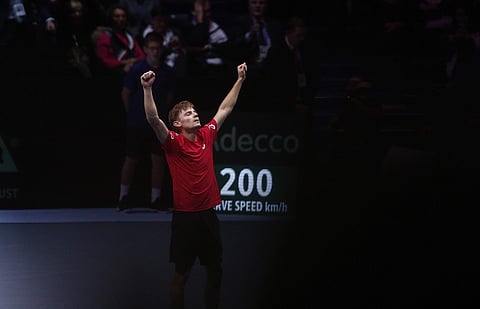 Belgium's David Goffin raises his arms as he defeats France's Jo-Wilfried Tsonga during their Davis Cup final single match | AP