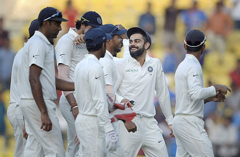 Indian captain Virat Kohli along with team mates return back to the pavalion at the end of the third day's play of the second Test match against Sri Lanka in Nagpur on Sunday. | PTI