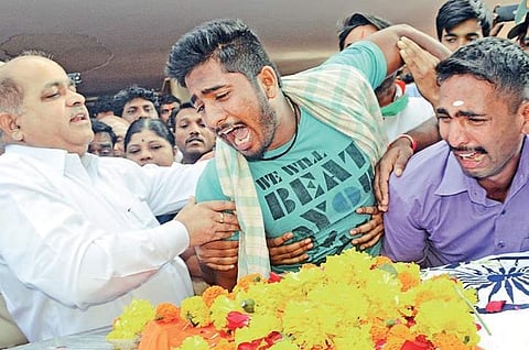 Basavraj Jakkannavar, elder brother of Manjunath Jakkannavar (inset), broke down when the mortal remains were brought to Dharwad on Tuesday | Express