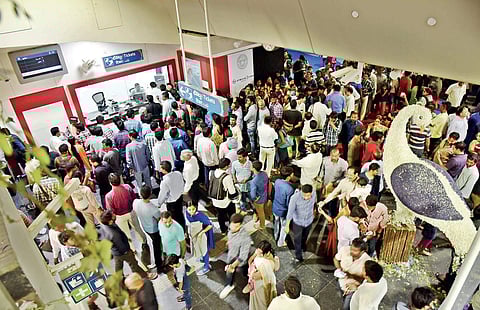 Passengers waiting to collect smart cards at Miyapur metro station ticket counter, in Hyderabad on Wednesday | vinay madapu