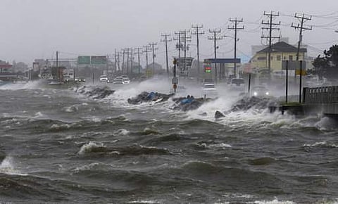 In this Saturday, Sept. 3, 2016 file photo, water from Roanoke Sound pounds the Virginia Dare Trail in Manteo, N.C., as Tropical Storm Hermine passes the Outer Banks. | AP