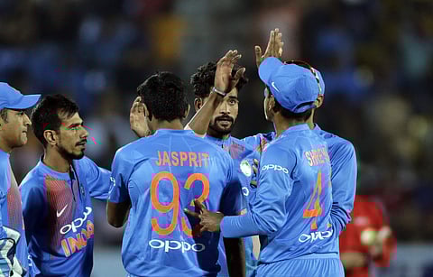 Indian cricketer Mohammed Siraj, center facing camera, celebrates with teammates after the dismissal of New Zealand's Kane Williamson during their second Twenty20 cricket match in Rajkot. | AP