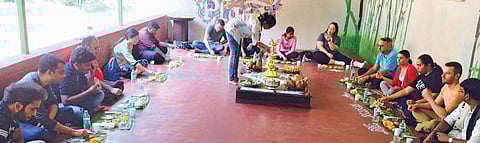 People savour the dishes served at India’s Royal Kitchen in Vontikoppal, Mysuru