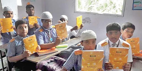 Students with recycled notebooks at the Learning Curve, an NGO in Bengaluru