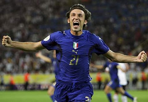 In this Tuesday, July 4, 2006 filer, Italy's Andrea Pirlo celebrates his side's first goal by teammate Fabio Grosso in the extra time of the semifinal World Cup soccer match between Germany and Italy in Dortmund, Germany. | AP