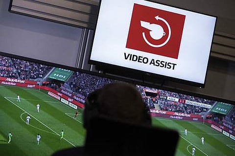 In this July 20, 2017 file photo referee Sascha Stegemann watches TV screens in the video assist center in Cologne, Germany. | AP
