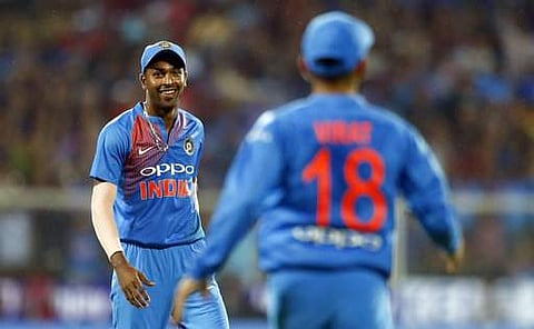 India's Hardik Pandya, left, celebrates with captain Virat Kohli the dismissal of New Zealand captain Kane Williamson during their third T20 in Thiruvananthapuram. | AP