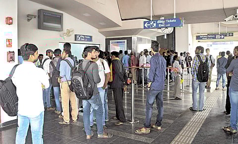 People wait in the queue at the ticket counter in SR Nagar Metro station, in Hyderabad | SAYANTAN GHOSH