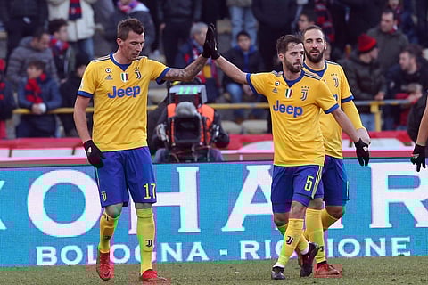 Juventus' Mario Mandzukic celebrates with Miralem Pjanic (R) after scoring his side's second goal | AP