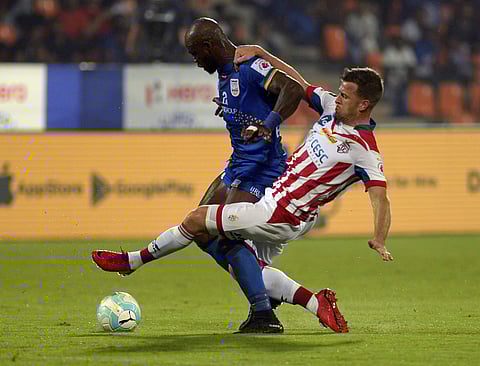 Players of Mumbai city FC and ATK in action during the ISL match in Mumbai on Sunday. (PTI)