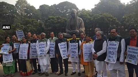 Leaders of Trinamool Congress hold protest at Mahatma Gandhi statue in Parliament demanding withdrawal of FRDI Bill.(Twitter Photo | ANI)