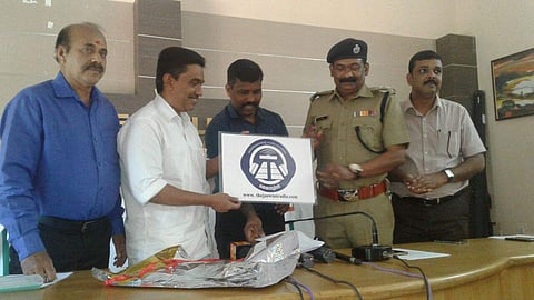 District panchayat president A G C Basheer unveiling the logo of Tejaswini Radio in Kasargod on Tuesday. (EPS)