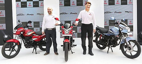 Malo Le Masson— head of global product planning with Markus Braunsperger, chief technology officer, Hero MotoCorp unveiling the three new motorcycles- the 125cc Super Splendor, the 110cc Passion PRO and the 110cc Passion XPRO on Thursday