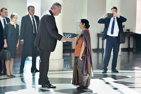 External Affairs Minister Sushma Swaraj shakes hands with Russian Deputy Prime Minister Dmitry Rogozin before a meeting in New Delhi on Saturday. (PTI Photo)