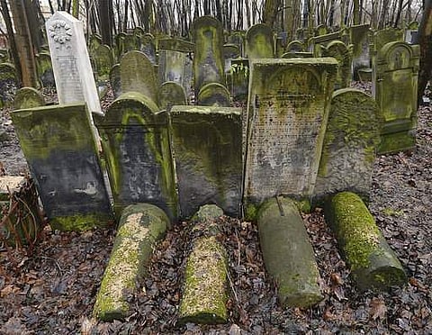 his photo shows gravestones at the Jewish Cemetery on Okopowa Street in Warsaw, Poland, Friday Dec. 22, 2017. The Polish government is donating 100 million zlotys (US$ 28 million) to preserve the cemetery. | AP