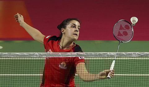 Olympic champion and world number four woman badminton player of Spain Cerolina Marin of Hyderabad Hunters returns a shot of Michelle Li of Canada of North Eastern Warriors. | AP