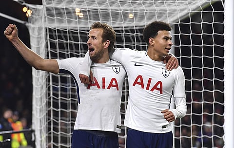 Tottenham Hotspur's Harry Kane, left, celebrates scoring his side's second goal of the game with teammate Dele Alli during their EPL match against Burnley. | AP