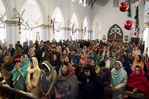 Representational Image. Pakistani Christians woman attend the Christmas mass at a church in Peshawar, Pakistan, Sunday, Dec. 25, 2016. (File | Associated Press/PTI)