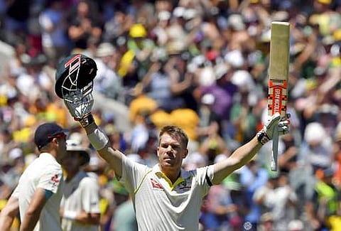 Australia's David Warner celebrates scoring a century against England during their Ashes cricket test match in Melbourne, Australia, Tuesday, Dec. 26, 2017.(AP)