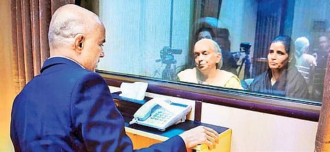 Former Indian Navy officer Kulbhushan Jadhav’s wife and mother meet him while separated by a glass partition, at the Pakistan Foreign Office in Islamabad on Monday | PTI/Twitter