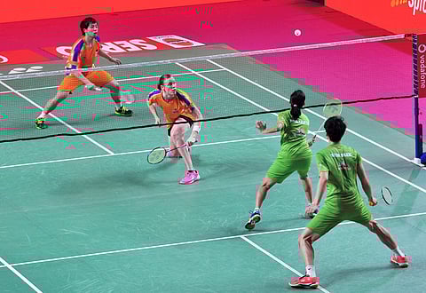 Prajakta Sawant and Shin Baek Cheol of North Eastern Warriors (green) action against Kamilla Rytter Juhl and Lee Chun Hej Reginald Verma of Ahemadabad Smash Masters in the mixed doubles event | PTI
