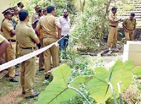 A team of police conducting inquest at the crime spot where the charred remains of a woman wev found in the backyard of her residence at Amabalamukku on Tuesday | Express