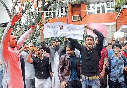 Students protest at the Indian Council for Cultural Relations office near Palace Cross Road in Bengaluru on Wednesday | S MANJUNATH