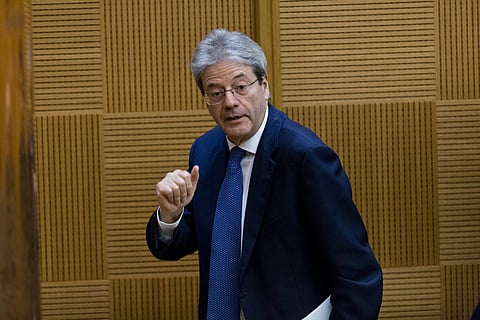 Italian Premier Paolo Gentiloni leaves after attending a year-end press conference in Rome, Thursday, Dec. 28, 2017. | AP
